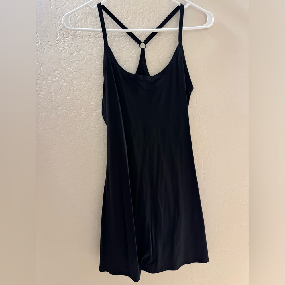 Outdoor Voices Tennis Dress with built in shorts with pockets.